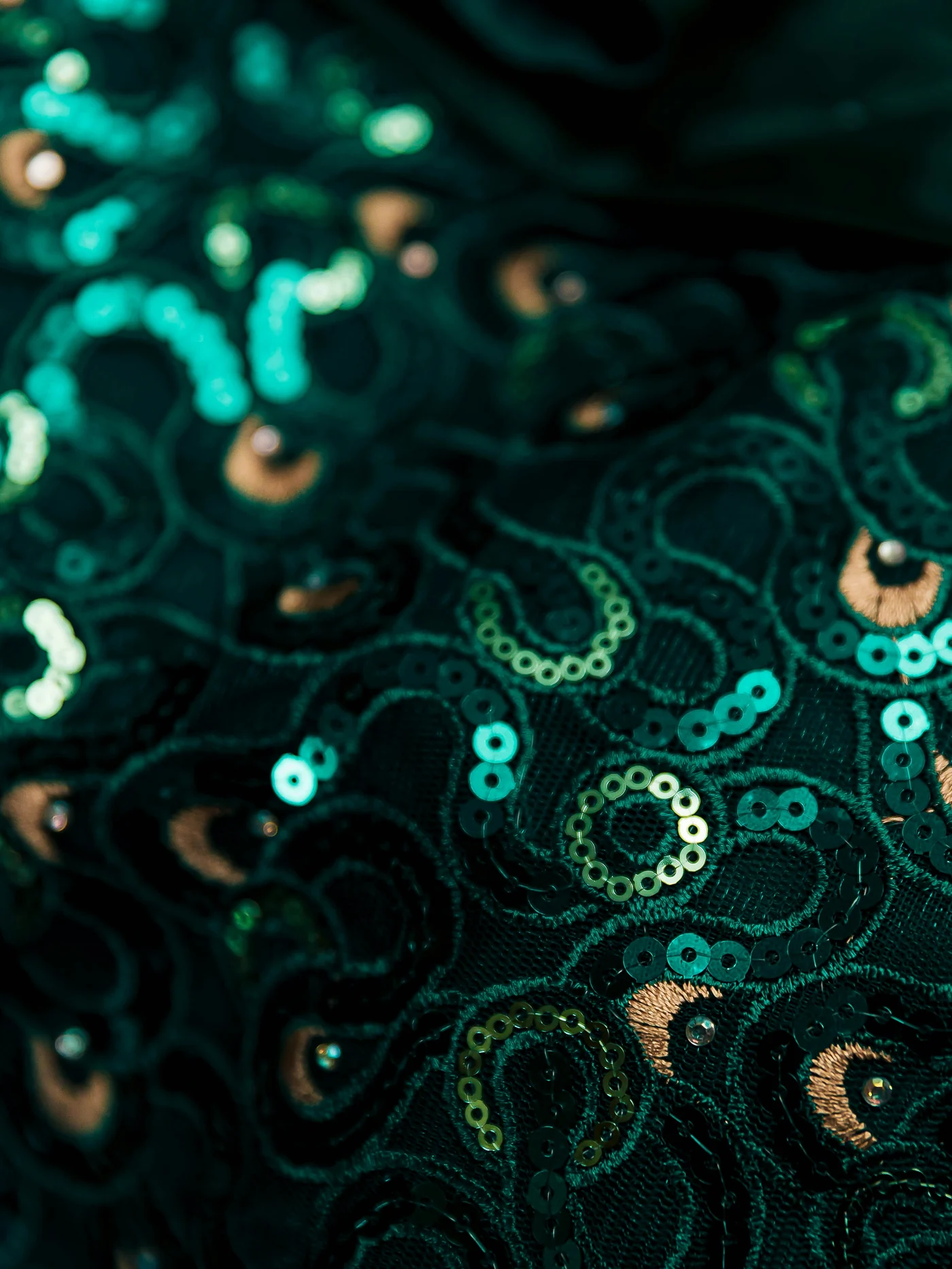 Emerald sequins embroidered in peacock-feather swirls