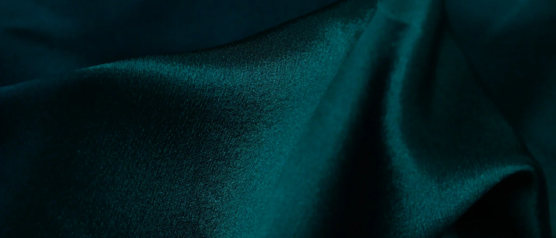 Deep peacock-teal satin in soft folds